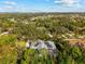 Home with solar panels and pool, aerial view at 7563 Albert Tillinghast Dr, Sarasota, FL 34240