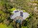 Home with solar panels and pool, aerial view at 7563 Albert Tillinghast Dr, Sarasota, FL 34240