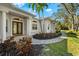 Elegant front entrance with double doors and stone pathway at 7563 Albert Tillinghast Dr, Sarasota, FL 34240