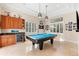 Game room with pool table, wet bar, and ample space for entertainment at 7563 Albert Tillinghast Dr, Sarasota, FL 34240