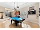 Fun game room, complete with a pool table and access to the lanai at 7563 Albert Tillinghast Dr, Sarasota, FL 34240