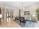 Living room featuring a large sofa, chairs, and area rug at 7563 Albert Tillinghast Dr, Sarasota, FL 34240