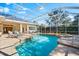 Inviting screened pool and spa with solar panels at 7563 Albert Tillinghast Dr, Sarasota, FL 34240