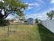 Backyard with shed, grass, and privacy fence at 7570 Berwick St, North Port, FL 34287