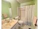 Clean bathroom with a bathtub, sink, and shower at 7570 Berwick St, North Port, FL 34287