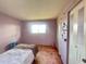 Simple bedroom with a twin bed, carpet, and window at 7570 Berwick St, North Port, FL 34287