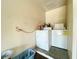 Laundry room with washer, dryer, and storage space at 7570 Berwick St, North Port, FL 34287