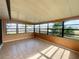 Sunroom with tiled floor and plenty of natural light at 7570 Berwick St, North Port, FL 34287