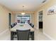 Dining room with table for six and access to patio at 820 Via Tunis, Punta Gorda, FL 33950