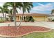 Single-Gathering home with circular driveway and palm trees at 820 Via Tunis, Punta Gorda, FL 33950