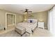 Large main bedroom with white bedroom suite and access to the bathroom at 820 Via Tunis, Punta Gorda, FL 33950