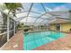 Large screened-in pool with brick deck and canal view at 820 Via Tunis, Punta Gorda, FL 33950