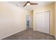 Bedroom with double door closet and carpet flooring at 2060 Willow Hammock Cir # 302, Punta Gorda, FL 33983