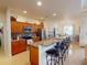 Open kitchen with granite island and breakfast bar at 26191 Copiapo Cir, Punta Gorda, FL 33983