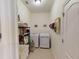 Bright laundry room with washer, dryer, and ample storage at 26191 Copiapo Cir, Punta Gorda, FL 33983