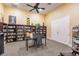 Community library with bookshelves, table, and chairs at 2060 Willow Hammock Cir # 302, Punta Gorda, FL 33983