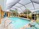 Refreshing pool with screened enclosure, perfect for outdoor relaxation at 26191 Copiapo Cir, Punta Gorda, FL 33983