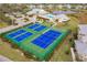 Well-maintained tennis courts with blue surface at 2060 Willow Hammock Cir # 302, Punta Gorda, FL 33983