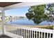 Enjoy this relaxing covered balcony overlooking a lake, green space, and neighboring buildings at 108 Pompano Se Dr # D, St Petersburg, FL 33705