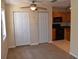 Open concept living room and kitchen with tile and carpet flooring at 108 Pompano Se Dr # D, St Petersburg, FL 33705