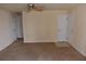 Neutral living room with a ceiling fan and front entry, perfect for relaxing and welcoming guests at 108 Pompano Se Dr # D, St Petersburg, FL 33705