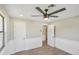 Charming bedroom with grey walls, wood-look flooring, and ceiling fan at 1219 Ansin St, Punta Gorda, FL 33950