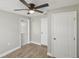 Bedroom with wood-look flooring, and exterior access at 1219 Ansin St, Punta Gorda, FL 33950