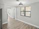 Dining area with wood-look floors and neutral color palette at 1219 Ansin St, Punta Gorda, FL 33950