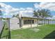 Rear view of house showing shed and fenced yard at 1219 Ansin St, Punta Gorda, FL 33950