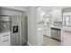 Modern kitchen features white cabinets, stainless steel appliances, and quartz countertops at 1219 Ansin St, Punta Gorda, FL 33950