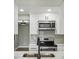 Modern kitchen with stainless steel appliances and white shaker cabinets at 1219 Ansin St, Punta Gorda, FL 33950