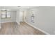 Light-filled living room with wood-look floors and neutral walls at 1219 Ansin St, Punta Gorda, FL 33950