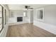 Living room with built-in seating, fireplace, and wood-look floors at 1219 Ansin St, Punta Gorda, FL 33950