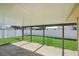 Covered patio overlooking fenced backyard at 1219 Ansin St, Punta Gorda, FL 33950