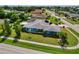 Aerial view showing a single-Gathering house with a large yard, and solar panels at 125 Severin Se Rd, Port Charlotte, FL 33952