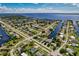 Wide aerial view of waterfront property, showcasing home and canal access at 125 Severin Se Rd, Port Charlotte, FL 33952