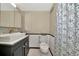 Clean bathroom with updated vanity, toilet and shower at 125 Severin Se Rd, Port Charlotte, FL 33952