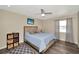 Bright bedroom with a light blue comforter and built-in shelving at 125 Severin Se Rd, Port Charlotte, FL 33952