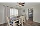 Dining area with table and chairs, offering a view into the kitchen at 125 Severin Se Rd, Port Charlotte, FL 33952