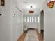 Bright and airy entryway with tile floors and built-in storage at 125 Severin Se Rd, Port Charlotte, FL 33952