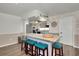 Modern kitchen with granite island and teal stools at 125 Severin Se Rd, Port Charlotte, FL 33952