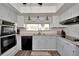 Updated kitchen with stainless steel appliances and white cabinets at 125 Severin Se Rd, Port Charlotte, FL 33952