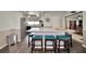 Modern kitchen with granite island and teal stools at 125 Severin Se Rd, Port Charlotte, FL 33952