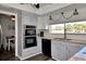 Modern kitchen with stainless steel appliances and white cabinets at 125 Severin Se Rd, Port Charlotte, FL 33952