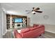 Living room features wood-look wall, fireplace, and comfy seating at 125 Severin Se Rd, Port Charlotte, FL 33952