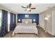 Main bedroom with king-size bed and blue accent wall at 125 Severin Se Rd, Port Charlotte, FL 33952