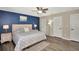 Spacious main bedroom with king-size bed and wood-look floors at 125 Severin Se Rd, Port Charlotte, FL 33952