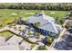 Community clubhouse surrounded by lush landscaping at 14138 Poppy Field Loop # 4122, Punta Gorda, FL 33955