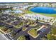 Aerial view of community clubhouse, pool, and lush landscape at 14138 Poppy Field Loop # 4122, Punta Gorda, FL 33955