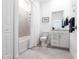Well-appointed bathroom featuring a shower/tub, white vanity, and tile flooring at 14138 Poppy Field Loop # 4122, Punta Gorda, FL 33955